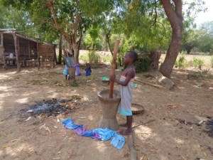 Girls pounding maize in the morning on Kirepwe Island