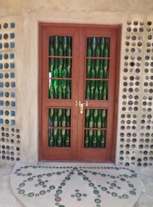 Recycled wine bottle door by Andrew McNaughton at EcoWorld, Watamu