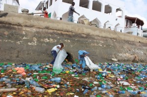 Children picking plastic bottles is from the port of Lamu. Picture courtesy Dipesh Pabari