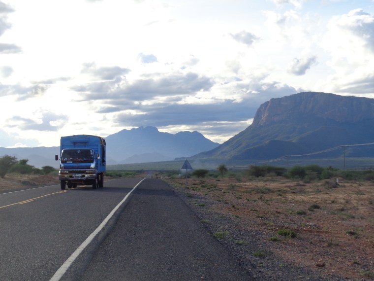 The iconic loaf-shaped mountain Ololokwe, and the Warges of the Mathews Range behind - a high peak at 8,000 feet high above the plains. Tthe local Samburu call Mathews Range Ol-doinyo Lenkiyieu It stretches 80 kilometers north copyright Rupi Mangat