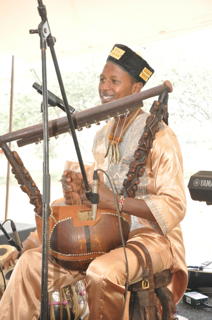 Papillon starred at the Google event at African Heritage House playing an assortment of hand made musical instruments based on instruments thousands of years old. He wears a velvet cap studded with “fetish gold” from the Baoule of Ivory Coast.