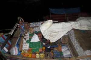 Dhow being loaded at Lamu island with sugar, soap, oil to sail to other islands of Lamu archipelago Photo: Maya Mangat