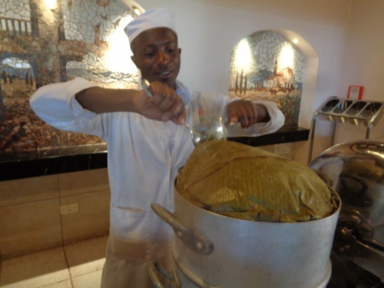 Ugandan dish of bananas (matoke) - served with groundnut sauce (benyenoa) -a dish of the Buganda from central Uganda. Copyright Rupi Mangat