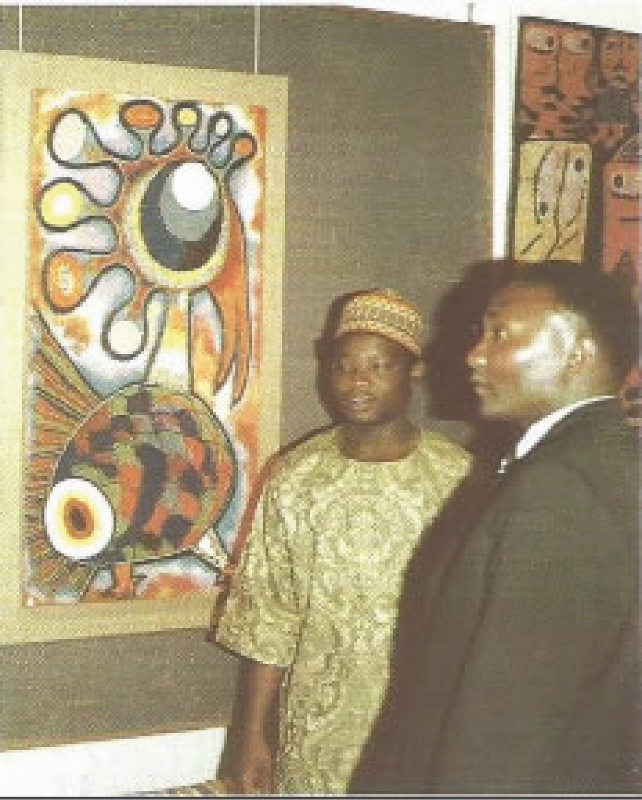 Jimoh Buraimoh with one of his beaded paintings in l972 Copyright Alan Donovan