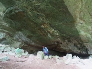 Handrison Mwameso in the gigantic cave in Taita Hills. Copyright Rupi Mangat