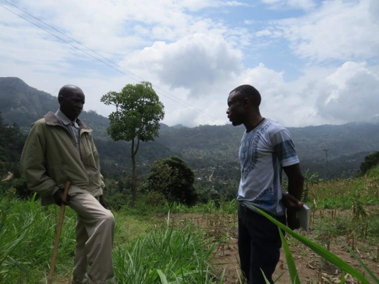 Hendrison Mwameso, a guide with Dawida Biodiversity Conservation group (DABICO) asks around for the historical caves of Vuria in Taita Hills - copyright Rupi Mangat