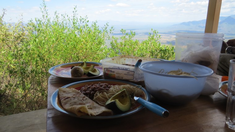 Lunch on porch of Mountain cabin in Sekerr Range.Copyright Rupi Mangat