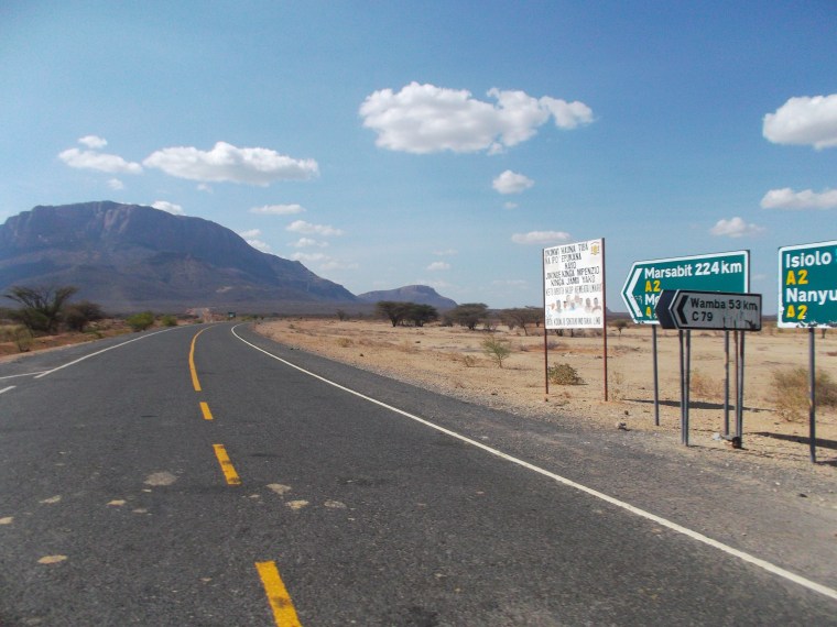The new tarnac road to the north past Samburu and the Mt Lolokowe - the bread-shaped iconic mt of the north.