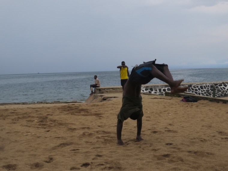 Boy practising acrobatics by Lake Kivu in Gisenyi, Rwanda. Copyright Rupi Mangat (800x600)