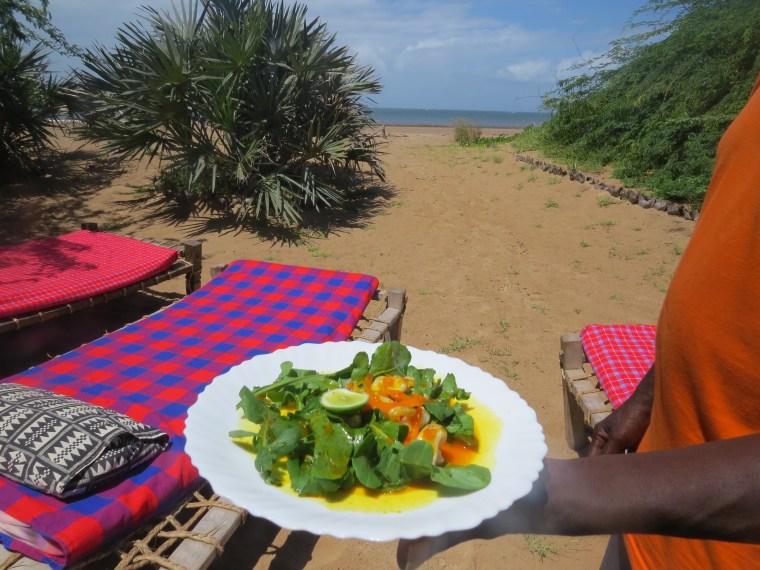 Calamari in orange saucewith a tinge of saffron at Barefoot Beach Camp in Malindi. Copyright Rupi Mangat