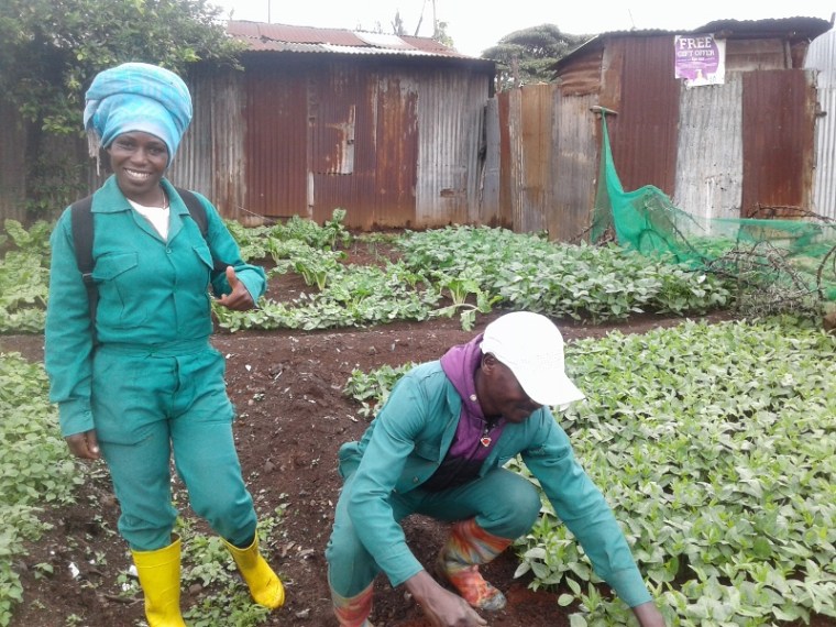 Debora Ogollah and Daniel Ndungu in the vegetable polt to feed the kids in Korogocho slum, Nairobi. Copyright Rupi Mangat (800x600)