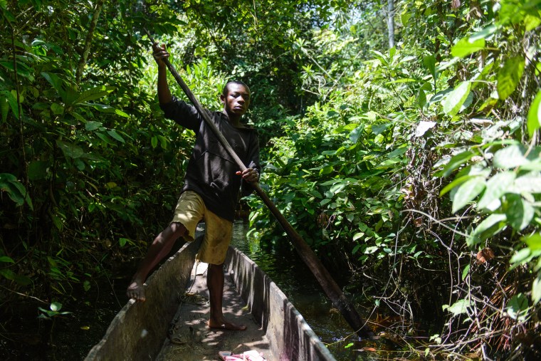 Traversing Nouabalé Ndoki National Park often requires travel by dugout canoe Photo Credit Gautam Shah